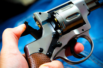Image showing revolver in human hand
