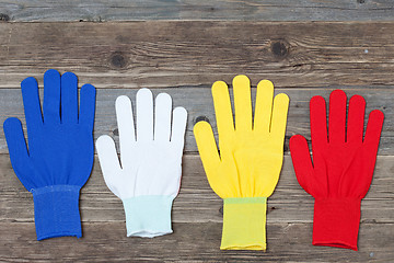 Image showing working multicolored gloves