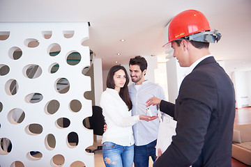 Image showing couple buying new home with real estate agent