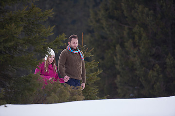 Image showing couple having fun and walking in snow shoes