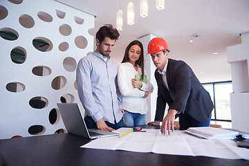 Image showing couple buying new home with real estate agent