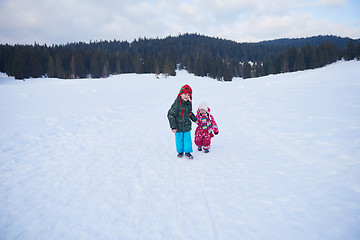 Image showing kids walking on snow