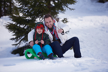 Image showing portrait of father and son on snow