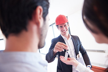 Image showing couple buying new home with real estate agent