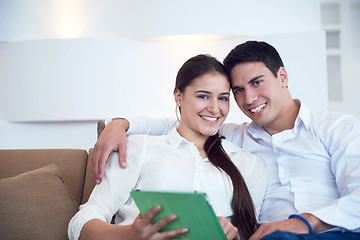 Image showing couple at modern home using tablet computer