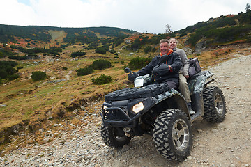 Image showing couple drive atv quad bike