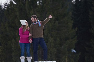 Image showing couple having fun and walking in snow shoes