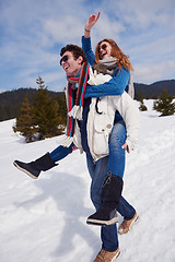 Image showing happy young couple having fun on fresh show on winter vacation