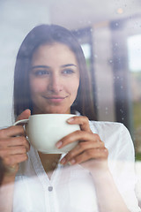 Image showing beautiful young woman drink first morning coffee