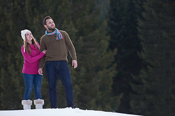 Image showing couple having fun and walking in snow shoes