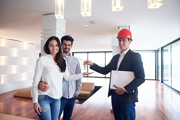 Image showing couple buying new home with real estate agent