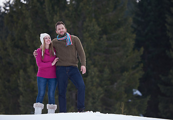 Image showing couple having fun and walking in snow shoes