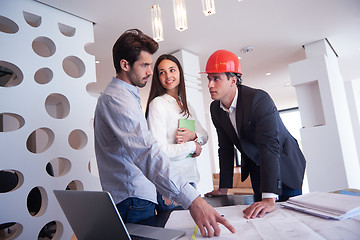 Image showing couple buying new home with real estate agent