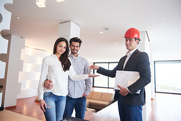 Image showing couple buying new home with real estate agent