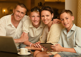 Image showing family sitting with laptop