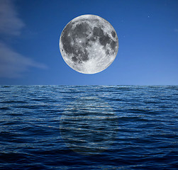 Image showing Full moon at night over the sea