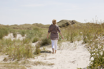 Image showing Vacationer in dune landscape