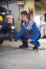 Image showing Mechanic checking diesel exhaust emission rates