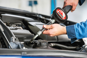 Image showing Oil change with an electronic dosage system