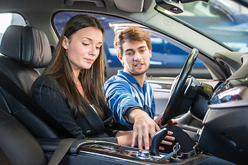 Image showing Mechanic demonstrating a second hand car to a potential customer