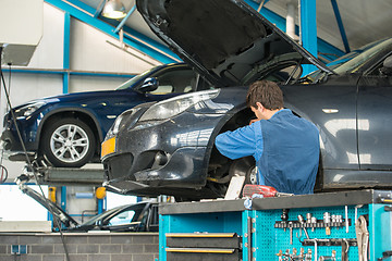 Image showing Mechanic at work in a garage