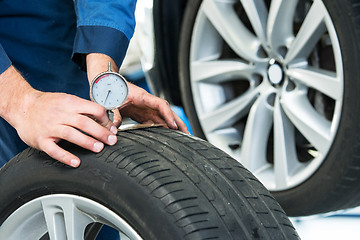 Image showing Measuring the depth of a tire tread or profile