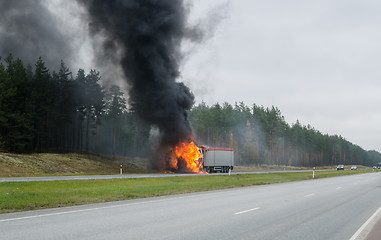 Image showing The burning truck on the road