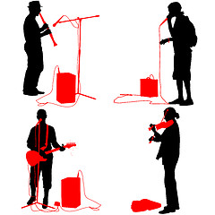 Image showing Set  silhouettes  musicians playing musical instruments. 