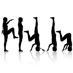 Image showing Black silhouette  woman in yoga pose on white background. 