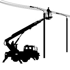 Image showing Electrician, making repairs at a power pole. 