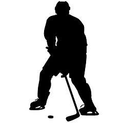 Image showing silhouette of hockey player. Isolated on white. 