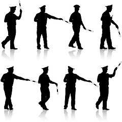 Image showing Set black silhouettes  Police officer  with a rod on white 