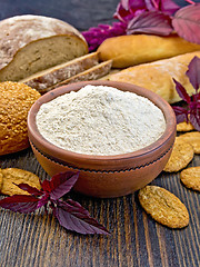 Image showing Flour amaranth in clay bowl with cookies on board