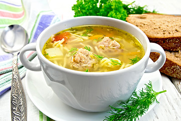 Image showing Soup with meatballs and noodles in bowl on saucer