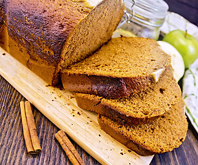 Image showing Bread apple with cinnamon on dark board