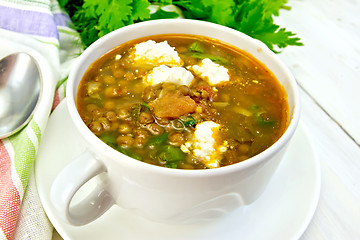 Image showing Soup lentil with spinach and feta on light board