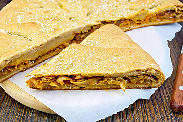 Image showing Pie with cabbage and sesame on paper