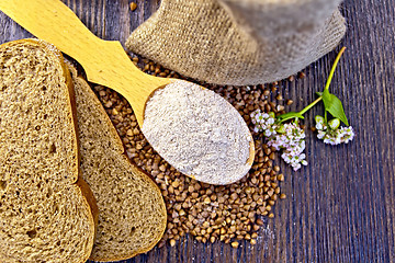 Image showing Flour buckwheat in spoon with grains on board top