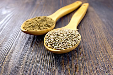 Image showing Flour and seed of hemp in spoon on board