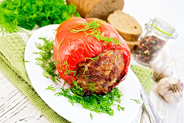 Image showing Pepper stuffed meat with dill in plate on table