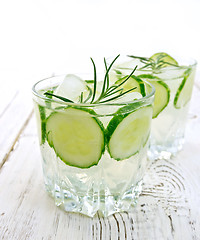 Image showing Lemonade with cucumber and rosemary in two glassful on table