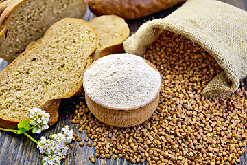 Image showing Flour buckwheat in bowl with grains on board