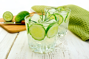Image showing Lemonade with cucumber and rosemary in two glassful on board
