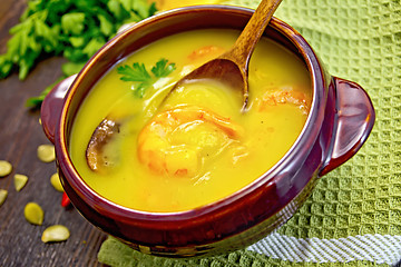 Image showing Soup-puree pumpkin with prawns and mushrooms on napkin