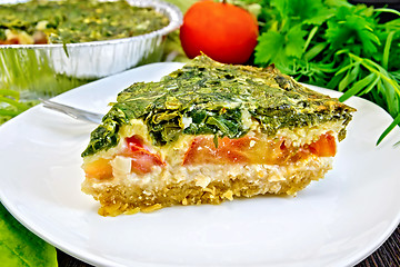 Image showing Pie celtic with spinach and tomatoes on board