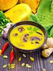 Image showing Soup-puree pumpkin with mushrooms on board