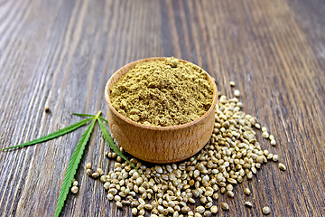 Image showing Flour hemp in bowl of grain and leaf on board