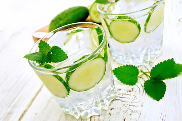 Image showing Lemonade with cucumber and mint on white board
