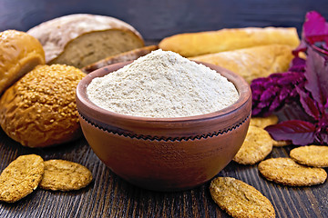 Image showing Flour amaranth in clay bowl with bread on board