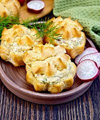 Image showing Appetizer of radish and cheese in profiteroles on clay plate wit